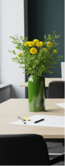 Workspace with green wall and flowers